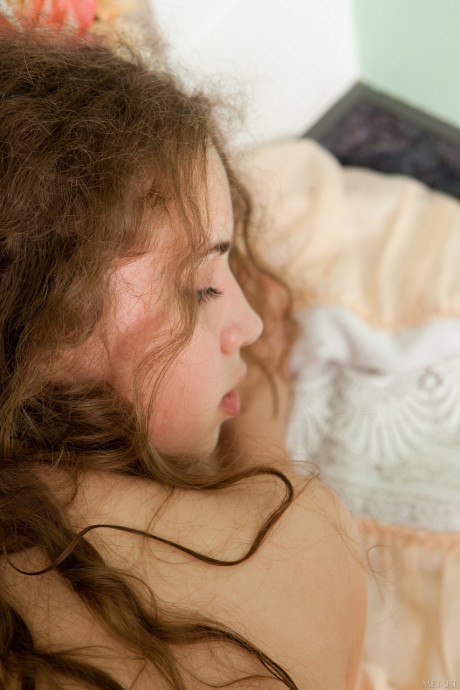 Curly haired babe with tiny breasts Wanda A exposes her bushy cunt