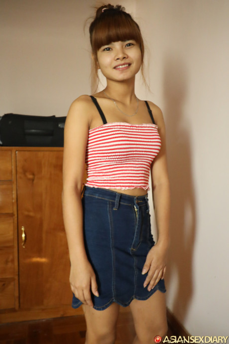 Beautiful fine asian teen Mildred B	flaunts her tiny breasts as she gets nailed in POV