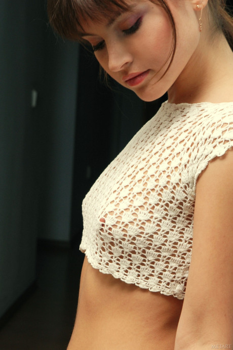 Glamorous teenie with a ponytail Anna Q poses undressed and in her pretty lingerie