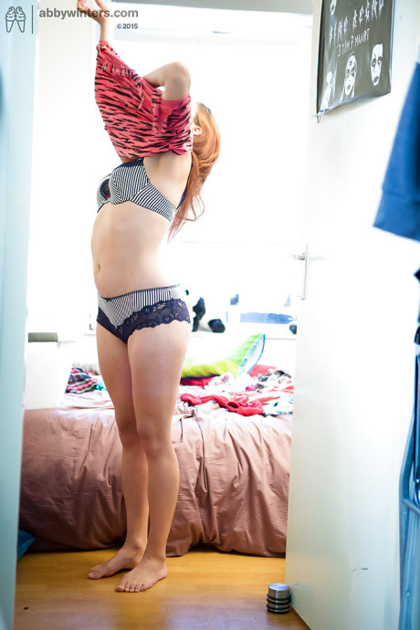 Hairy amateur Lynn caught on hidden camera getting dressed after undressed poses