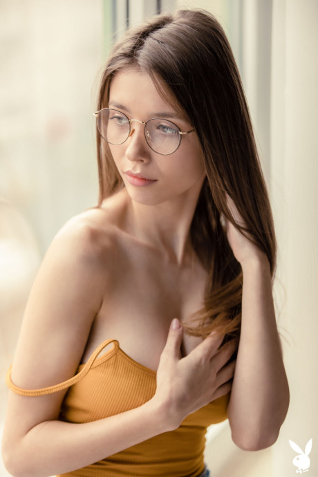 Alluring babe Mila Azul unveils her ravishing large tits in a sexy striptease