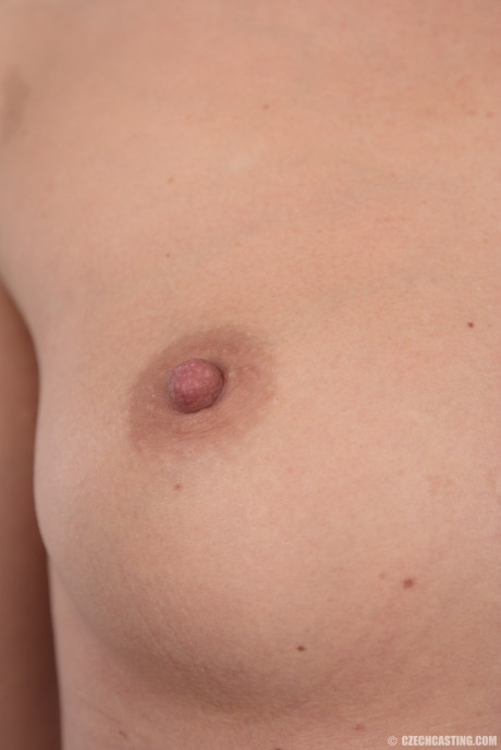 Blondie amateur Aneta stands totally naked after removing her clothing