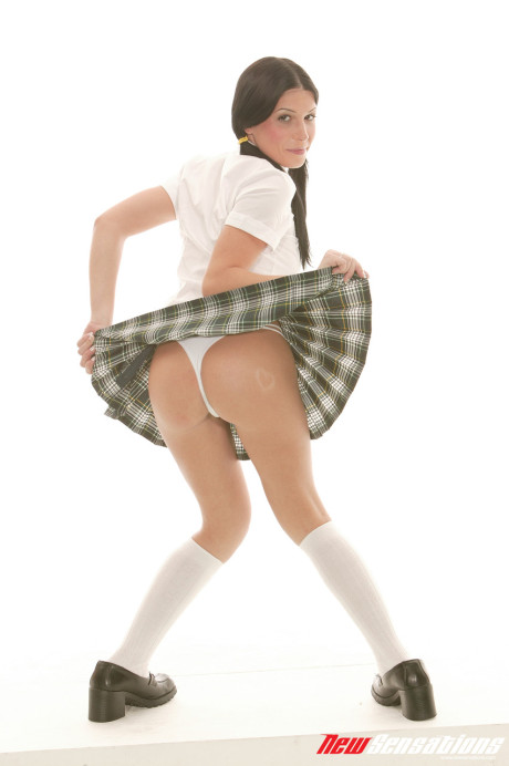Brunette schoolgirl Rebeca Linares strips and licks a dong before anal sex