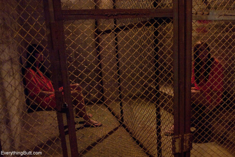 Dirty inmates show their breasts while changing into their prison uniforms